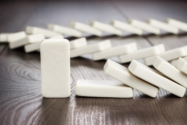 domino piece standing still concept